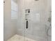 Sleek bathroom showcases tiled shower with a glass door and built-in shelving at 260 Miller Reed Se Ave, Atlanta, GA 30315