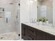 Modern bathroom featuring a glass-enclosed shower, double sinks, and a marble countertop at 260 Miller Reed Se Ave, Atlanta, GA 30315