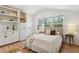 Bright bedroom features a kitchenette, hardwood floors and large window with natural light at 260 Miller Reed Se Ave, Atlanta, GA 30315
