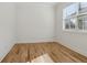 Bright bedroom features a window and hardwood floors at 260 Miller Reed Se Ave, Atlanta, GA 30315