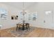 Bright dining area featuring hardwood floors, modern chandelier, and natural light at 260 Miller Reed Se Ave, Atlanta, GA 30315