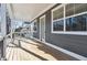 Covered front porch showcasing gray siding, white trim, and a wood floor at 260 Miller Reed Se Ave, Atlanta, GA 30315