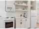 Modern kitchenette features white cabinetry, stainless steel appliances and quartz countertops at 260 Miller Reed Se Ave, Atlanta, GA 30315