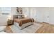 Comfortable main bedroom has hardwood floors, neutral decor, and large windows providing bright, natural light at 260 Miller Reed Se Ave, Atlanta, GA 30315