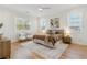 Bright and airy main bedroom features hardwood floors, neutral decor, and large windows with bright, natural light at 260 Miller Reed Se Ave, Atlanta, GA 30315