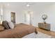 Spacious main bedroom features hardwood floors, a ceiling fan, neutral decor, and a walk-in closet at 260 Miller Reed Se Ave, Atlanta, GA 30315