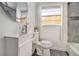 Cozy bathroom featuring a sleek vanity, modern fixtures, and stylish wall tiles at 3076 Cloverhurst Dr, Atlanta, GA 30344