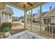 Covered back porch showing outdoor living space with view of other properties in the community at 625 Aunt Lucy Sw Ln # 34/19, Smyrna, GA 30082