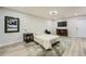 Finished basement with bed, TV, modern lighting, and access to exterior at 625 Aunt Lucy Sw Ln # 34/19, Smyrna, GA 30082