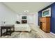 Modern bedroom with blue accent wall, wood floors and comfortable furniture at 625 Aunt Lucy Sw Ln # 34/19, Smyrna, GA 30082