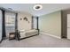Guest bedroom features neutral carpet, modern lighting, and plenty of natural light at 625 Aunt Lucy Sw Ln # 34/19, Smyrna, GA 30082