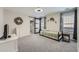 Cozy bedroom with gray carpet, barn door closet, and sunburst mirror adds character to the space at 625 Aunt Lucy Sw Ln # 34/19, Smyrna, GA 30082