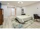 Well-lit bedroom with wood-look floors, a large rug, and a comfortable seating area at 625 Aunt Lucy Sw Ln # 34/19, Smyrna, GA 30082