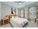 Cozy bedroom with carpet, ceiling fan, natural light from windows and floral curtains at 625 Aunt Lucy Sw Ln # 34/19, Smyrna, GA 30082
