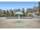 Community pool area with mushroom water feature and covered gathering space at 625 Aunt Lucy Sw Ln # 34/19, Smyrna, GA 30082