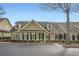 Exterior view of house with neutral paint, black shutters, dormer windows, and stone accents at 625 Aunt Lucy Sw Ln # 34/19, Smyrna, GA 30082