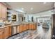 Updated kitchen featuring granite counters, stainless steel appliances, wood cabinets, and an open floor plan at 625 Aunt Lucy Sw Ln # 34/19, Smyrna, GA 30082