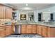 Updated kitchen featuring granite counters, stainless steel appliances, wood cabinets, and modern backsplash at 625 Aunt Lucy Sw Ln # 34/19, Smyrna, GA 30082