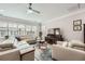 Bright living room with a large sectional sofa, modern furnishings, and stylish decor at 625 Aunt Lucy Sw Ln # 34/19, Smyrna, GA 30082