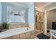 Beautiful primary bathroom featuring a tiled tub and glass-door shower at 625 Aunt Lucy Sw Ln # 34/19, Smyrna, GA 30082
