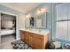 Bright primary bathroom features a double sink vanity and linen closet at 625 Aunt Lucy Sw Ln # 34/19, Smyrna, GA 30082