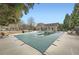 Community pool covered for the winter, and a pool house with lounge chairs, with a view of mature trees at 625 Aunt Lucy Sw Ln # 34/19, Smyrna, GA 30082