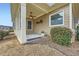 View of a covered porch with ceiling fan, decorative rug, and view to the side yard at 625 Aunt Lucy Sw Ln # 34/19, Smyrna, GA 30082