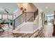 Modern staircase featuring a black steel banister and neutral carpet at 625 Aunt Lucy Sw Ln # 34/19, Smyrna, GA 30082