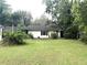 Single-story home with a well-maintained lawn and surrounded by mature trees at 2535 Glenwood Se Ave, Atlanta, GA 30317