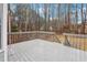 Back deck features gray wood and railing, overlooking foliage and open area at 112 Hollis Cir, Dallas, GA 30157