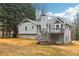 Exterior of home featuring a deck with staircase overlooking the backyard at 112 Hollis Cir, Dallas, GA 30157