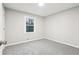 Bedroom featuring neutral walls, carpet, and a window at 112 Hollis Cir, Dallas, GA 30157