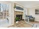 Close-up of stone fireplace with a white mantel and accents with lots of natural light at 112 Hollis Cir, Dallas, GA 30157