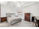 Bright main bedroom with trey ceiling, neutral color palette, and lots of light at 140 Stonegate Ln, Canton, GA 30114