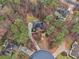 Aerial view of the home showing driveway and mature trees in the landscape at 3520 Bethwicke Dr, Cumming, GA 30040