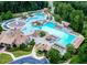 Aerial view of community pool and recreational area with water slides, lap pool, kiddie area and clubhouse at 520 Waterside Ct, Canton, GA 30114