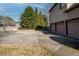 Long driveway leading to a three-car garage, offering ample parking space and well-maintained landscaping at 520 Waterside Ct, Canton, GA 30114