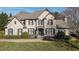 Traditional two-story brick home featuring a manicured lawn and well-maintained landscaping at 520 Waterside Ct, Canton, GA 30114