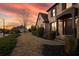 Charming brick home entrance with a neatly landscaped yard, accented by a walkway and a beautiful twilight sky at 520 Waterside Ct, Canton, GA 30114