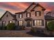 Beautiful brick home with manicured front yard and garden beds, viewed at twilight at 520 Waterside Ct, Canton, GA 30114