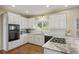 Kitchen with granite countertops, white cabinets, built in microwave, and open layout at 520 Waterside Ct, Canton, GA 30114