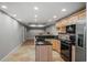 Modern kitchen features stainless steel appliances, granite countertops, and tile backsplash for a modern and durable design at 520 Waterside Ct, Canton, GA 30114
