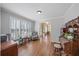 Spacious living room featuring hardwood floors, a sitting area, and abundant light at 520 Waterside Ct, Canton, GA 30114
