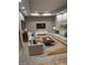 Comfortable living room with neutral furniture, recessed lighting, and a large rug complementing the tile flooring at 520 Waterside Ct, Canton, GA 30114
