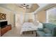 Comfortable main bedroom featuring a tray ceiling, neutral tones, and plenty of space at 520 Waterside Ct, Canton, GA 30114