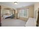 Serene main bedroom with tray ceilings, large windows, and ample natural light at 520 Waterside Ct, Canton, GA 30114