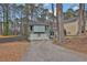 Home showcasing a two-car garage, basketball hoop, and spacious driveway at 670 Westbrook Pl, Lawrenceville, GA 30044