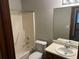 Functional bathroom with a standard tub/shower combo, toilet, vanity with sink, and a large mirror at 1281 Bugle Ct, Hampton, GA 30228