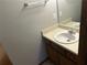 Clean bathroom with a single sink vanity, a large mirror, and tile flooring at 1281 Bugle Ct, Hampton, GA 30228