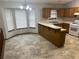 Cozy kitchen with ample counter space, natural light from windows, and wood cabinetry at 1281 Bugle Ct, Hampton, GA 30228